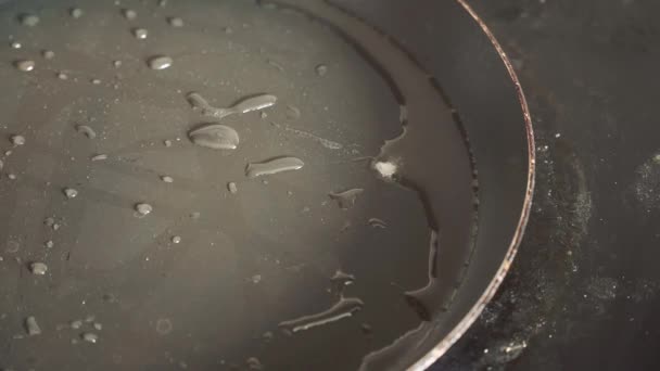 Oil on a hot griddle — Stock Video