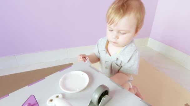 Baby plays with busy cube — Stock Video