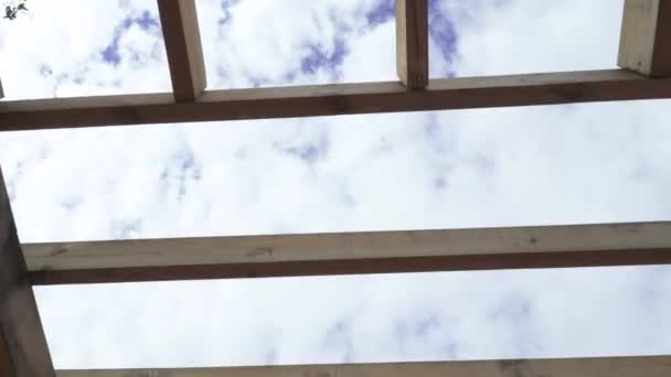 Wooden pergolas against a cloudy — Stock Video