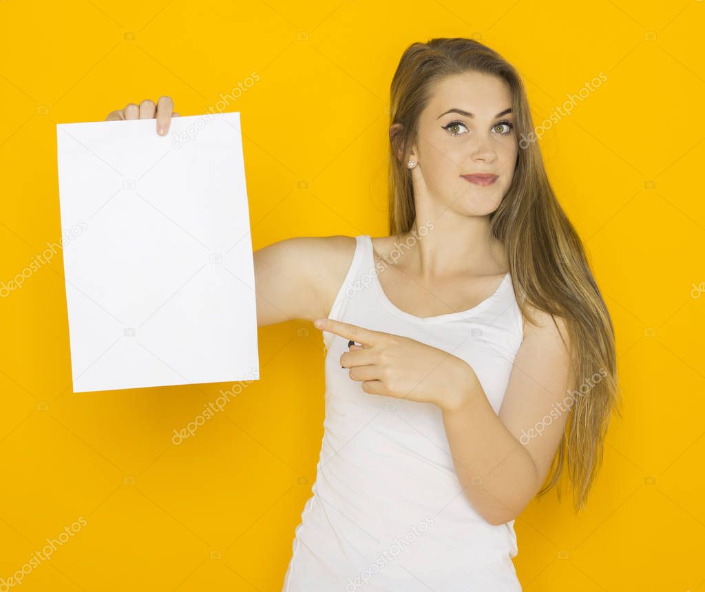 Nice young attractive woman holding blank paper