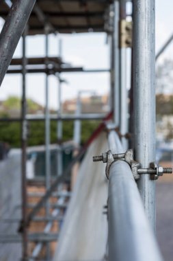 Detail of metal scaffolding on the building clipart