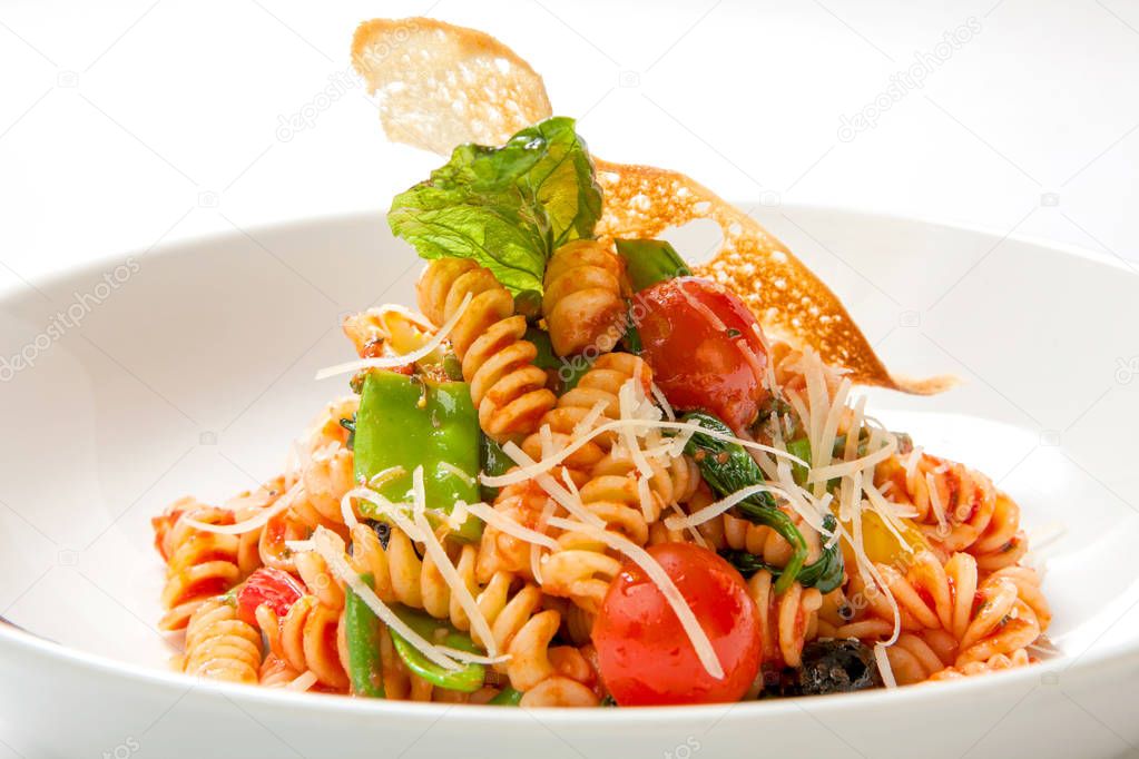 Pasta in tomato sauce with fried vegetables