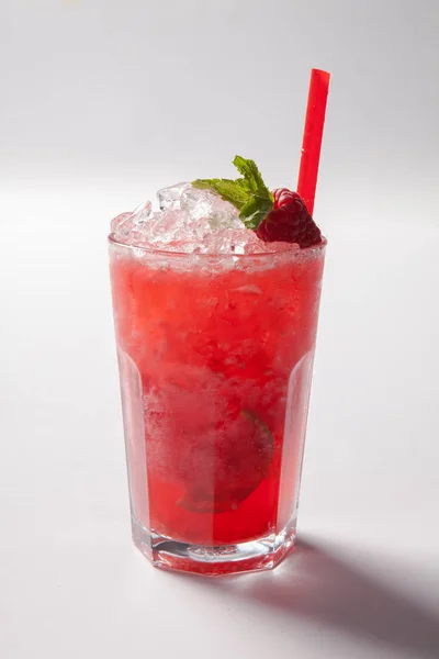 Cold straw red drink with berry and mint leaf. — Stock Photo, Image