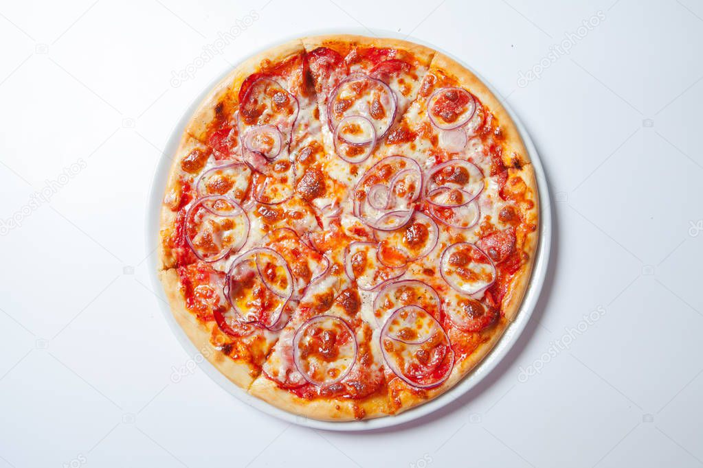 Pizza with onion, ham, cheese and tomato. White background
