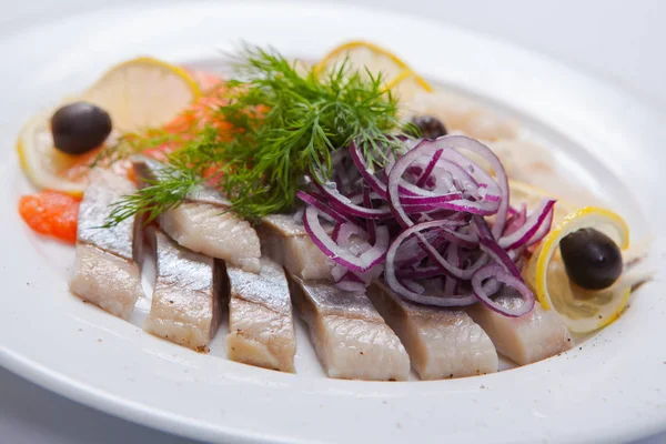 Sliced fish assortment with caviar and lemon — Stock Photo, Image