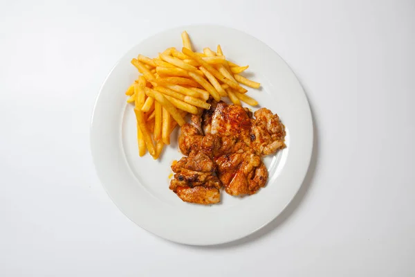 fried chicken with fries on white plate