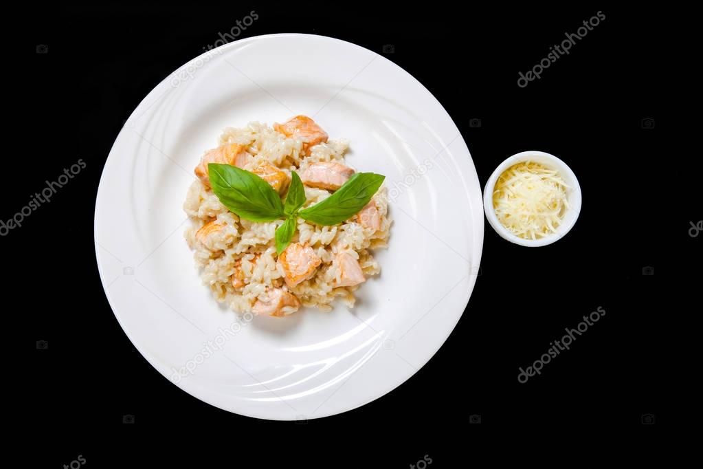 Risotto with salmon in a mild creamy sauce