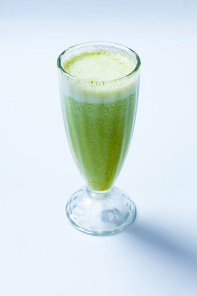 green vegetable smoothie on white backgroun. Celery smoothies