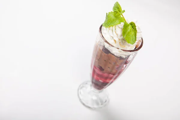 Sundae Ice cream with cherry in chocolate topping, decorated with mint