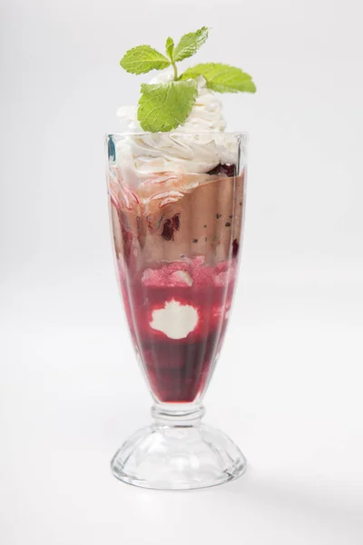 Sundae Ice cream with cherry in chocolate topping, decorated with mint