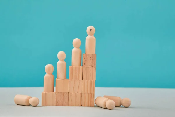 Career ladder. Team competition. Business growth. Pyramid wooden people figures. Human resource, Talent and Recruitment