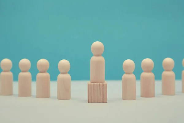 Career success mockup. Sense of purpose and efficiency. Leadership and superiority. Wooden leader figure stands on cube — Stock Photo, Image