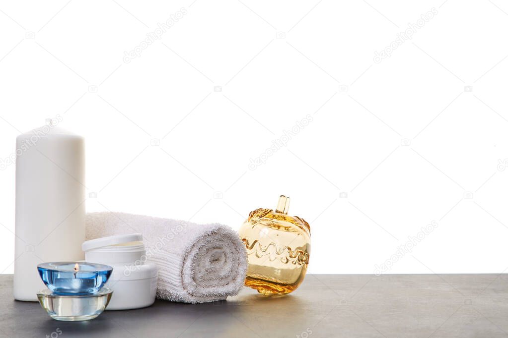 Towel glass container for candles. Wraps for body. Wellness and beauty concept. Spa day. Copy space. White background