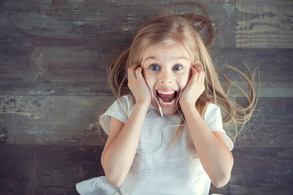 Amazed girl with earphones