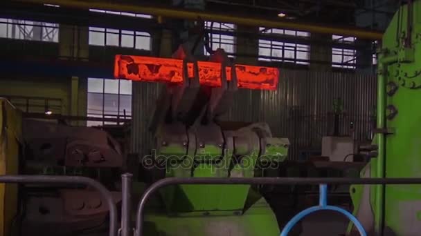 Manufacture of rails for trains and freight wagon, boxcars. Rail manufacturing plant. Stack of steel round bar - iron metal rail lines material for industry construction in warehouse. the big press — Stock Video