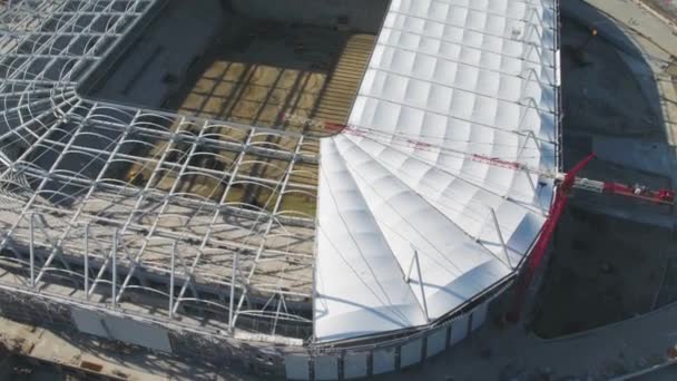 Aerial view on construction and reconstruction of football stadium. Reconstruction of stadium to host matches of world football championship in 2018. Russia. Construction company builds a stadium — Stock Video