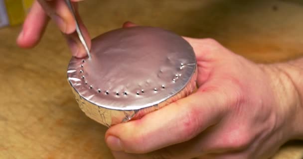 Bartender holding a clay bowl with tobacco for hookah covered with a foil with holes. Hookah topic: Bartender holding a clay bowl with tobacco for hookah covered with a foil with holes. Preparing the — Stock Video