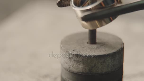 Production of rings. Jeweler working with wax model ring in his workshop. Craft jewelery making. Detail shot with low depth of field. Jeweler making handmade jewelry on vintage workbench. Craft of — Stock Video