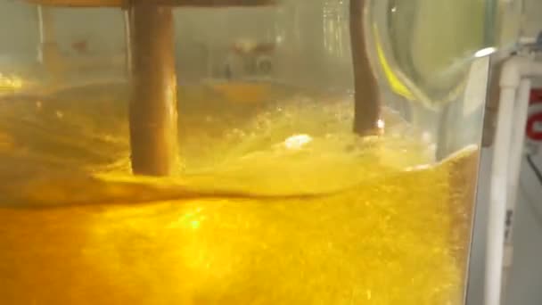 Close-up of colorful flask in which the liquid is mixed by a special device — Stock Video