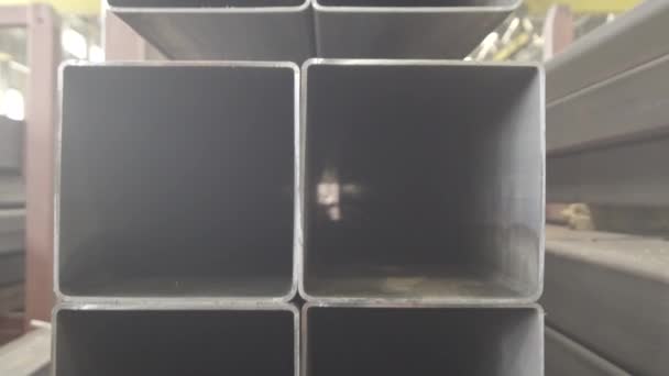 Stacked Steel Pipe With Sunlight Reflecting On The Interior Walls Of Central Part Rectangular Metal Pipe For Construction Pipes Rectangular Section