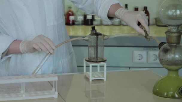 Close-up partial view of scientists making experiment with reagent and flasks. close up of biotechnology research in laboratory — Stock Video