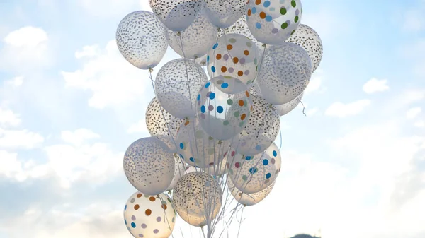 White balloons against the sky. White balls in the sky
