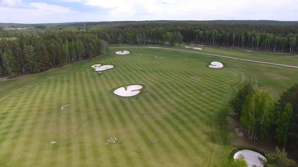 Top view green golf course outdoor green grass field. Aerial view from flying drone