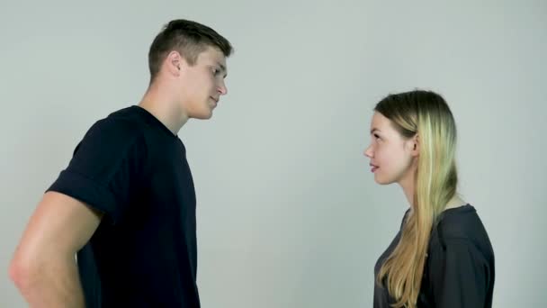 Woman slapping her boyfriend. isolated on a white background. Girl slaps her boyfriend on white background in slow motion — Stock Video