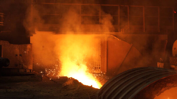 Liquid metal from blast furnace. Liquid iron from ladle in the steelworks