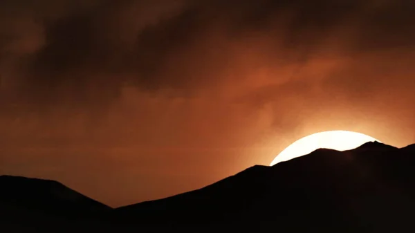 Beautiful sand dunes in the Sahara desert. Beautiful sunset in the mountains. Colorful landscape with sun, sinrise or sunrays and blue sky animation