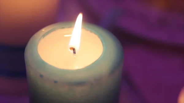 Lighting A Candle With A Match To Get A Romantic Candlelight. Amazing andles and candlesticks are on the table. Stay lights with the peaceful background of religious ceremony. — Stock Photo, Image