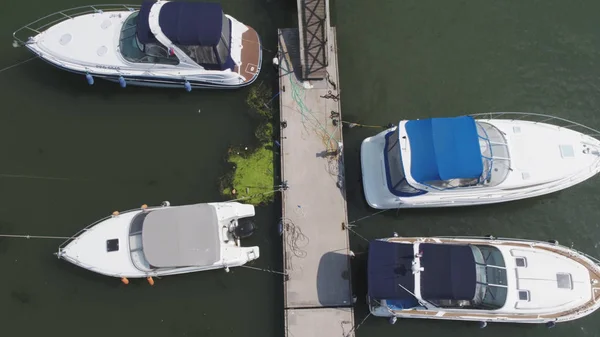 Sailboats moored in the port, a lot of beautiful yachts. Top view on Yachts and boats moored in the port — Stock Photo, Image