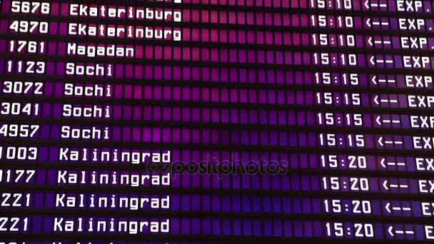 Departures board at the airport. Flight information electronically timetable. Split flap mechanical departures board. Flight schedule. Scoreboard flights — Stock Video