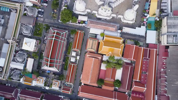 Nice view from the top of houses with tiled roofs. Top view of modern and old houses of the city. Cityscape of town and city from top view. Old and modern architecture of different styles. Authentic