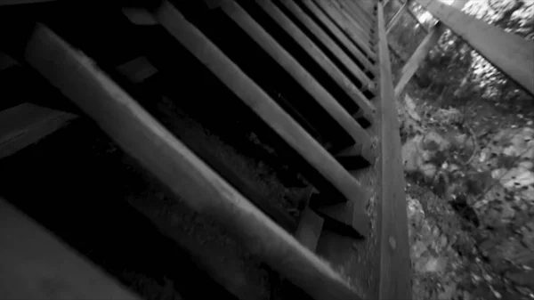 Bottom view of old stairs sky background black and white. Footage. Thai wooden house stair style. Old wooden bridge at the river — Stock Photo, Image