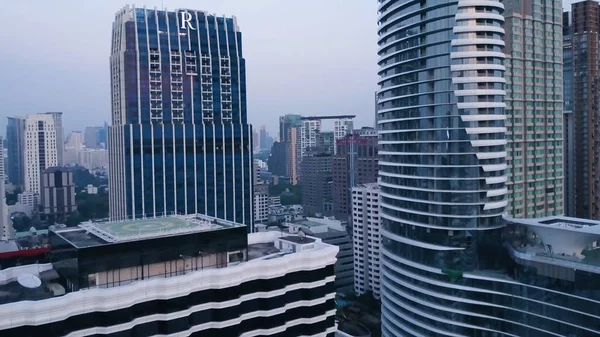 Aerial of an amazing landscape on a city with modern skyscrapers and enterprises. Top view on a developed town with office buildings and advanced infrastructure. Top view of modern town with — Stock Photo, Image