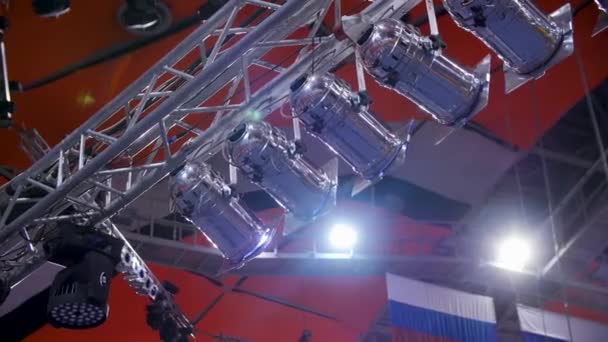 Spotlight. Many spotlights that illuminate the stage at a concert. Stage Spotlight with Laser rays at event conference hall. — Stock Video