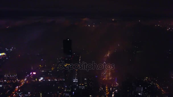 Spectacular aerial view of Victoria Harbor, skyscrapers and Hong Kong skyline at night. Aerial view of Hong Kong city. Hong Kong city at night — Stock Video