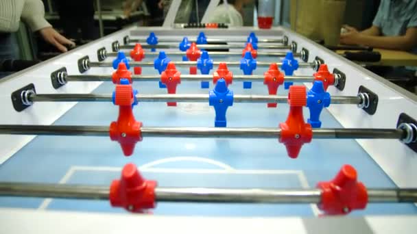 Table football soccer game kicker . Table football game, Soccer table with red and blue players. Young friends playing table football together indoors — Stock Video