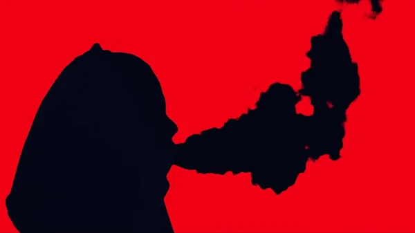 Анімація паління людини на червоному тлі. Чоловічий портрет куріння сигарети силует в студії ізольований червоний фон. Силует молодого чоловіка, який курить марихуану суглоба, концепція ліків на червоному — стокове фото