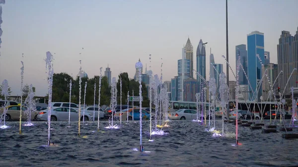 Water fountain. Outdoor fountains. Beautiful splashes of water illuminated from below, the evening. Slow motion