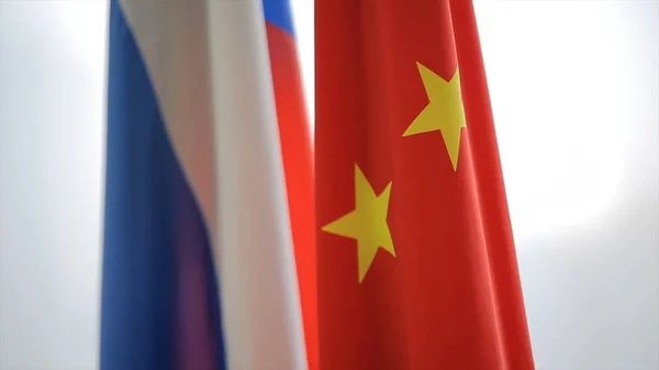 Русский и китайский флаги. Два флага России и Китая, символизирующие сотрудничество двух держав — стоковое фото