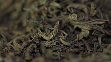 Çay otlar doku. Yeşil çay. Organik kurutulmuş yeşil çay yaprakları. Yığın kuru yeşil çay arka plan bırakır. Makro