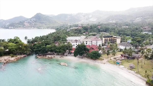 Aerial of Beautiful Fisherman Village and Pier, Top View. Video. Top view of a tropical village by the sea