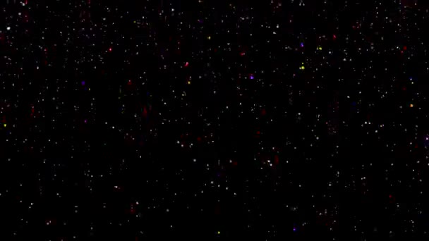 Animation of color beads on a black background. The color animation of falling crumbs. Loop fotage — Stock Video