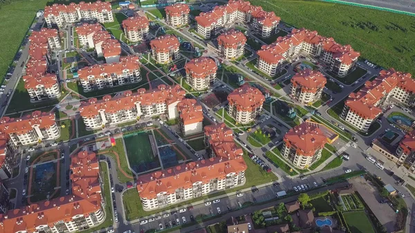 Aerial view apartment buildings complex and residential houses neighborhood. Clip. Top view of the modern luxery residential complex