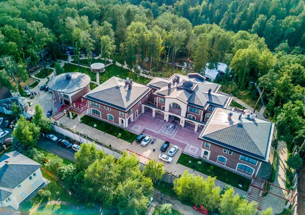 Beautiful old villa garden from above, green garden. Top view of luxury country house