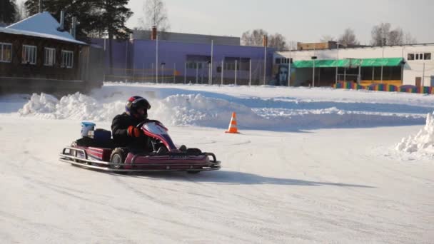 Winter competitions of kart racing on the ice of road. Go kart in winter — Stock Video