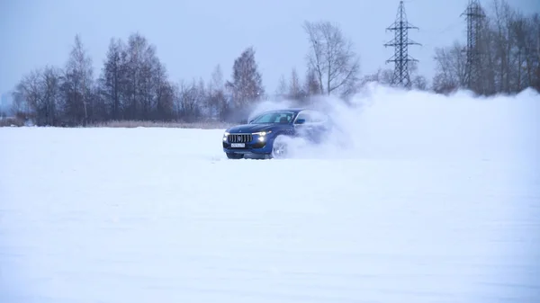 Sliding on an ice line. Snow drifting. snowy land road at winter — Stock Photo, Image