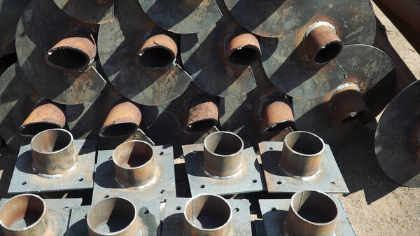 Metal billet pieces of pipes. Clip. Stainless Steel Buttweld Pipe Fittings elbow in stockroom